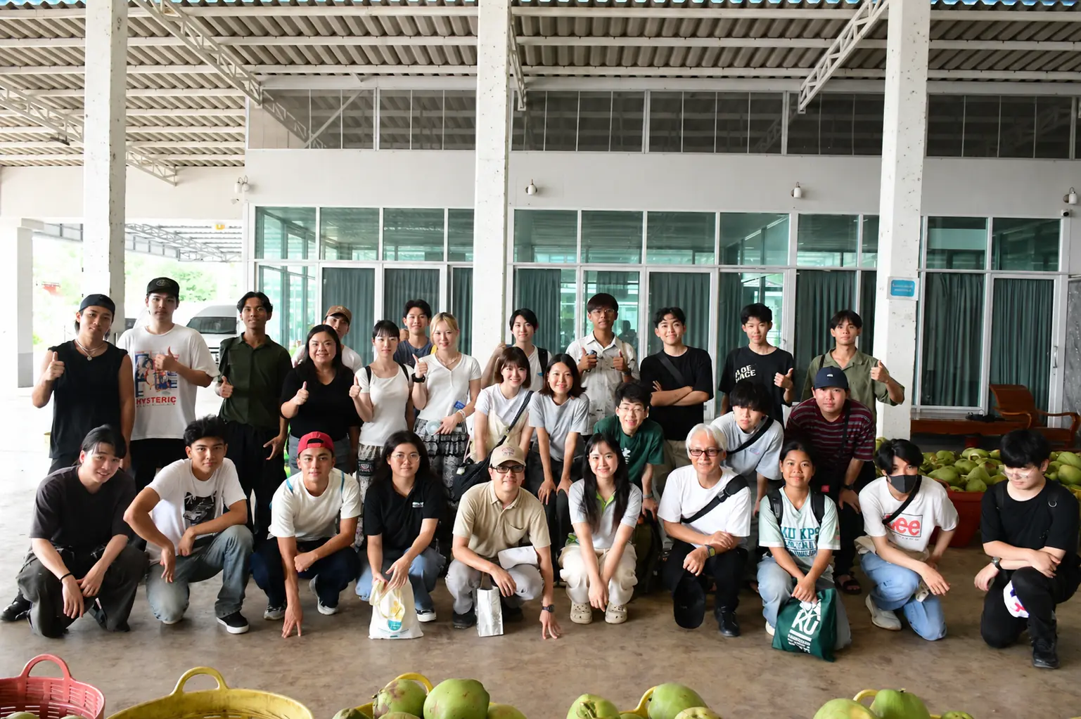 Faculty and students from Tokyo University of Agriculture in a group photograph at Coconut Breeze Damnoen Saduak Co., Ltd.